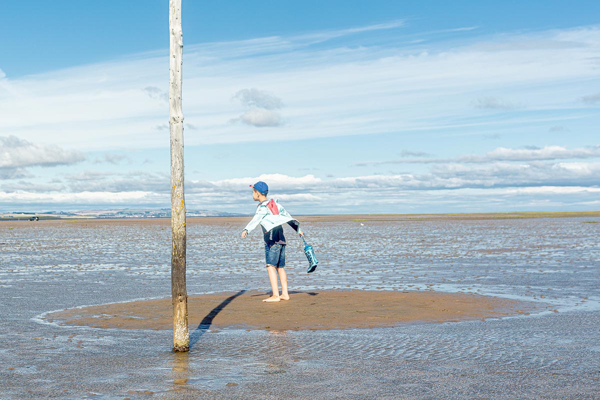 A child is on an island on the Pilgrim’s path.