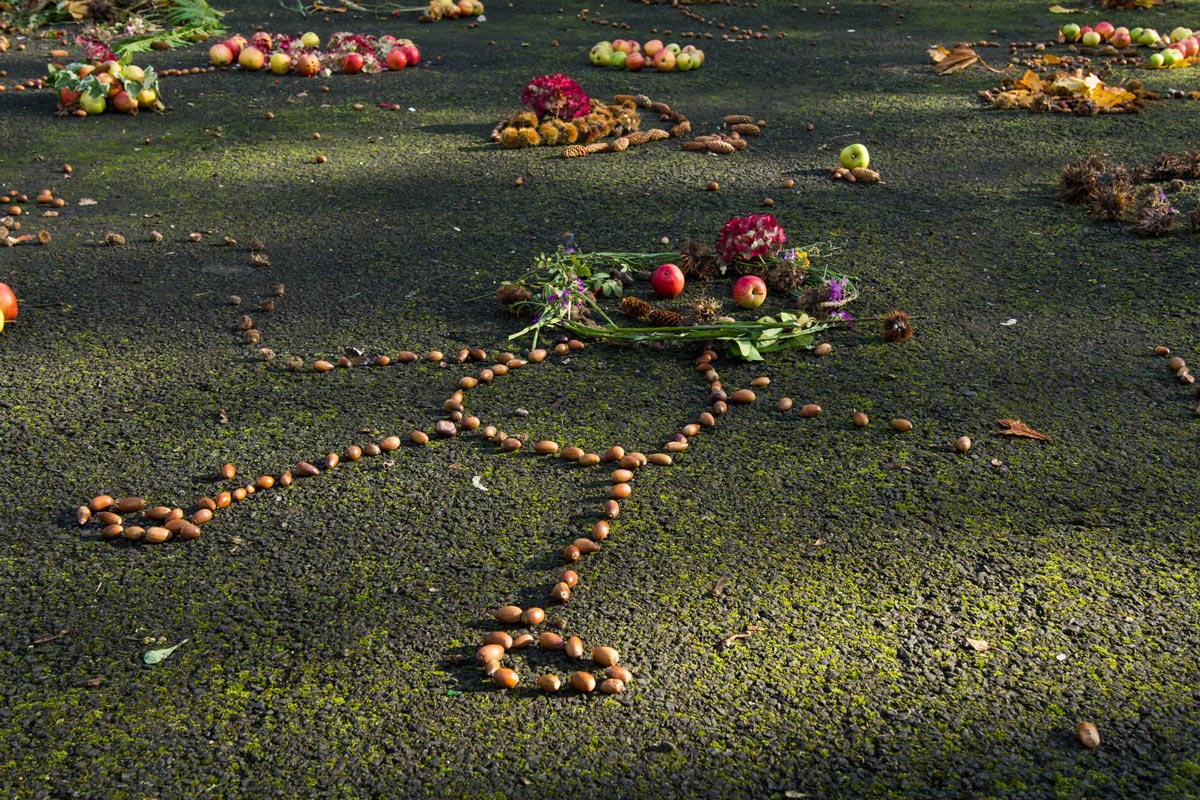 A stick person shaped part of the foraged installation in sun light. 