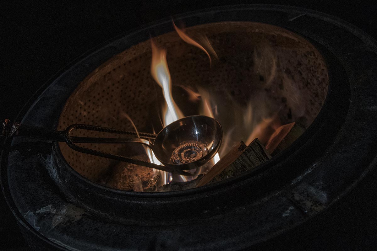 A piece of tin is melted in a fire.